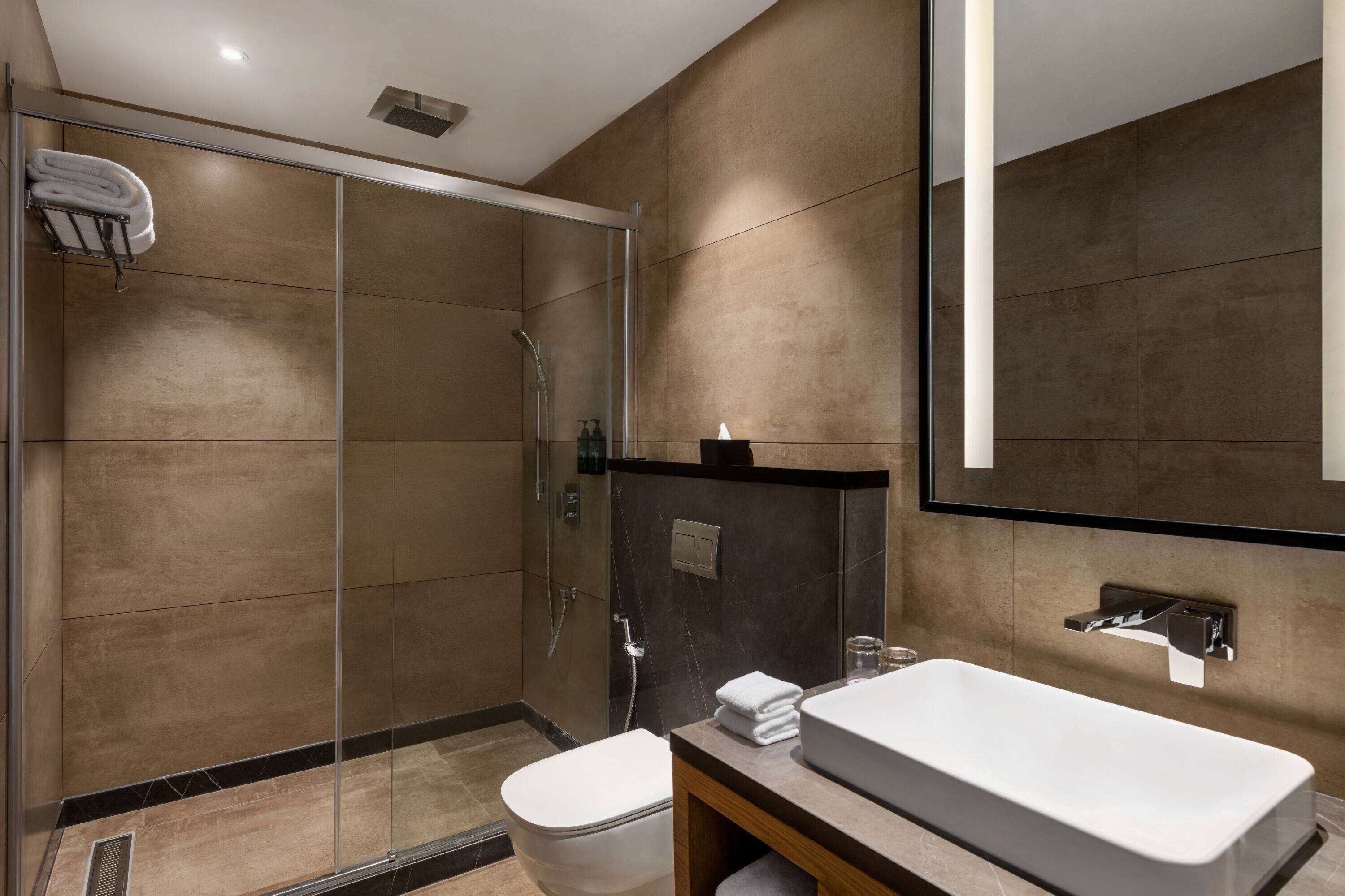 junior suite, 1 king bed | bathroom | shower, rainfall showerhead, eco-friendly toiletries, hair dryer