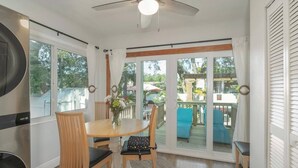 A dining area with a table, chairs, and a ceiling fan. - La Casita Solar II (Clearwater)