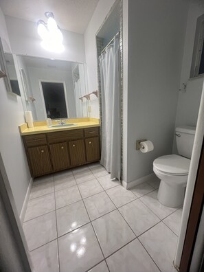 Shower, hair dryer, towels, toilet paper
