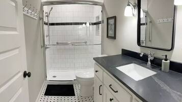 Shower, hair dryer, towels, soap