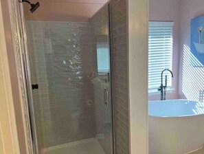 Shower, hair dryer, towels, soap