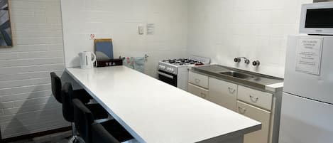 Coffee/tea maker, fridge, microwave, oven