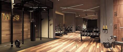 A modern gym with weightlifting equipment, cardio machines, and a wooden floor.