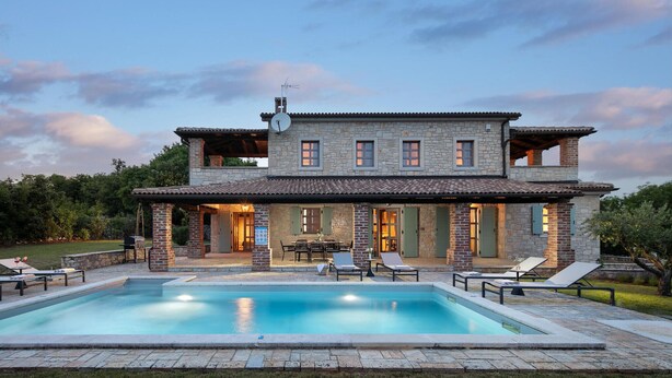 A two-story stone house with a swimming pool, outdoor seating, and a covered patio area. - 4 bedroom nice home in Sveti Lovrec (Sveti Lovrec)