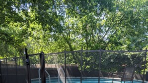 A wooden deck with steps leading to a pool area, surrounded by a fence and trees. - South Austin Charmer with Backyard Oasis (Austin)