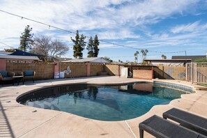 Outdoor pool, a heated pool - 4BR Happy Harmont House w/ Private Pool • Near State Farm Stadium • Sleeps 10 (Glendale)