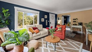Living area - Charming 1920s Olympia home with game room, fenced yard, blocks from Capitol (Olympia)