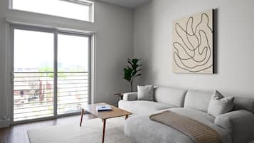 Condo, Multiple Beds, Kitchen, City View (Unit 301) | Living area | 40-cm TV with digital channels