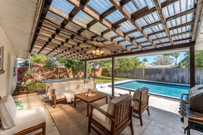 Outdoor dining - Modern Seaside Boho Home – Stylish House with Private Pool & Spacious Backyard! (Cocoa Beach)