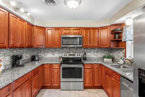 Fridge, microwave, oven, stovetop - Seaside Escape with Private Backyard Oasis: Heated Pool, Hot Tub & Movie Nights 🌴 (Cocoa Beach)