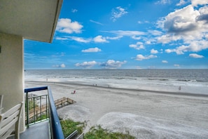 Enjoy breathtaking views of the beach from this balcony with access to the shore.