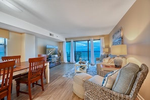Relax in this inviting living area with a sofa, dining table, and comfortable seating.