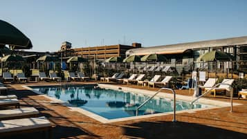 Outdoor pool, open 11:00 AM to 9:00 PM, pool loungers