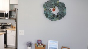 A kitchen with white cabinets, a microwave, and a stainless steel range hood. - 3BR Home Sleeping 6 Near Downtown Palmer With Mountain Views  (Palmer)