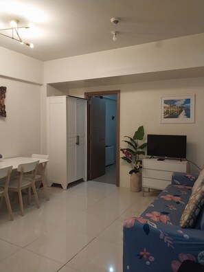 Family Condo, 1 Bedroom, Non Smoking, City View | Living area | 43-inch Smart TV with cable channels