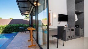 A modern room with a glass wall, a pool, a desk, and a TV. - Thames Tara Private Pool Villa Rawai Phuket (Rawai)