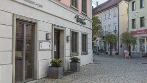 A building with a sign reading 'BAR RESTAURANT CAFE' and a smaller sign 'No. 1'.