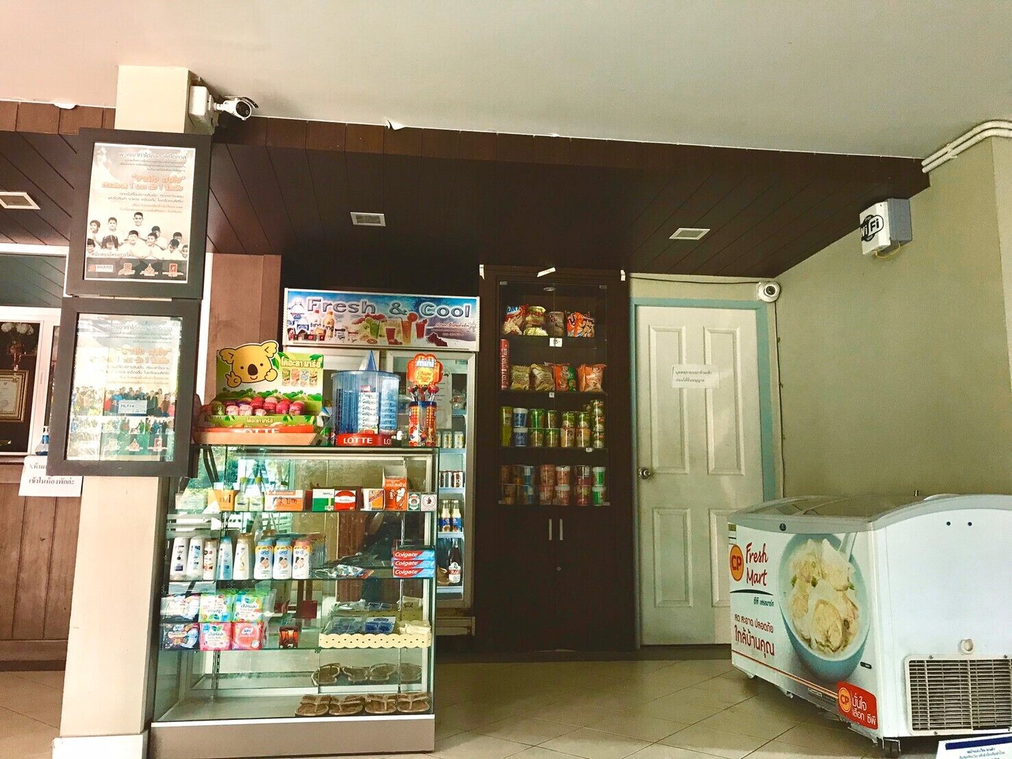 A small convenience store with a variety of products including snacks, beverages, and toiletries.