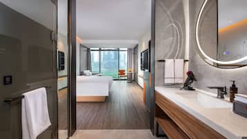 Executive Room, 1 Queen Bed | Bathroom | Shower, hair dryer, slippers, towels