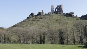 A hill with ruins at the top. - Oaks (Swanage)