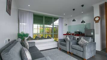 Exclusive Bungalow, 1 Bedroom | Living area | 45-inch flat-screen TV with digital channels