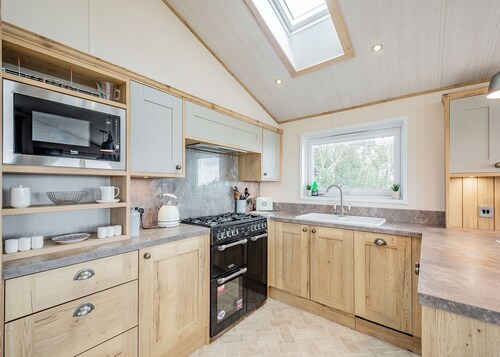Country and modern cladded lodge with sea views.