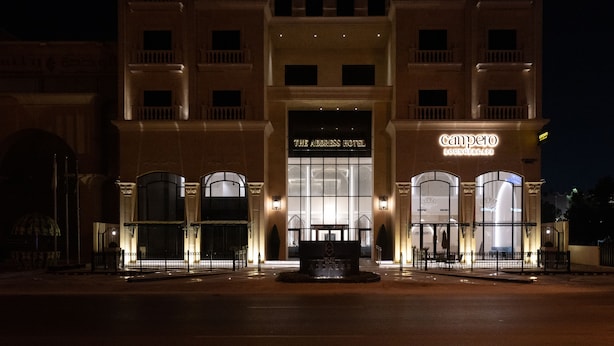 A hotel with a grand entrance, a well-lit lobby, and a sign for the Address Hotel and Campero Lounge & Restaurant. - Alenwan Serviced Apartments (Al Khobar)