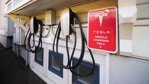 A Tesla vehicle charging station attached to a building with a sign indicating it is for Tesla vehicles only. - Relax in the luxurious 1-bedroom Louisa Suite at RedTail Inn. Enjoy a double rain shower, plush linens, and a shared hot tub. Located near downtown Ashland, with off-street parking and high-speed WiFi. (Ashland)