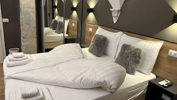 Premium bedding, down duvets, memory-foam beds, minibar