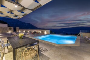 Relax by the pool surrounded by breathtaking mountain views.