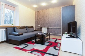 Classic Apartment | Living area | 42-inch flat-screen TV with cable channels - Beautiful apartments in modern district (Minsk)