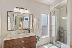 Bathtub, hair dryer, towels, soap