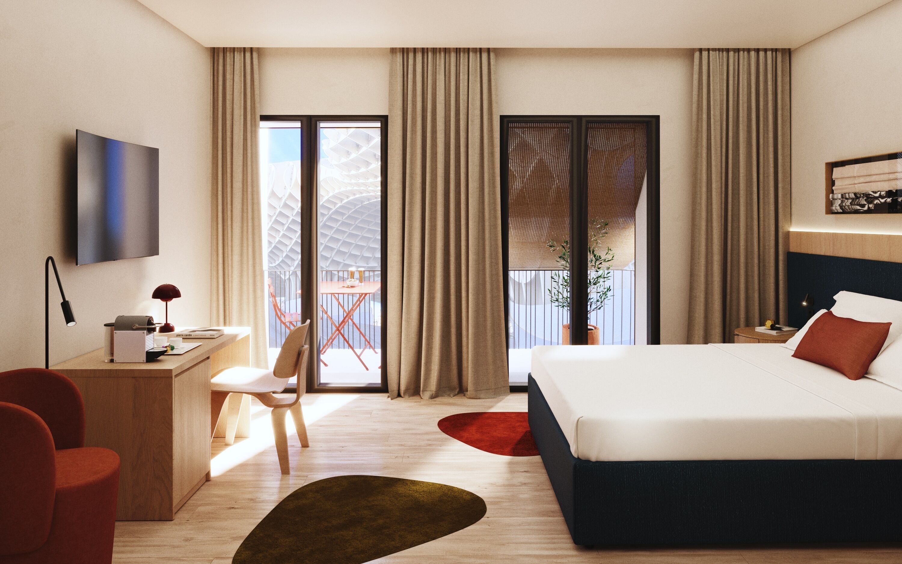 A modern hotel room with a bed, desk, chair, and a view of the outside balcony.