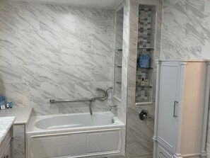 Shower, jetted tub, towels