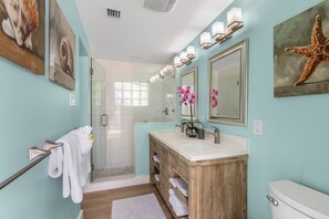 Shower, hair dryer, towels