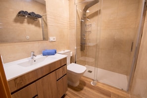 Shower, hair dryer, towels, soap