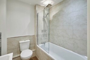 Bathtub, towels, shampoo