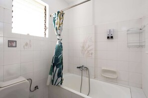 Shower, hair dryer, towels, shampoo