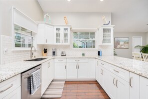 Fridge, microwave, oven, stovetop - Coastal Cottage-Heated Pool Home w/ Fire Pit (Port Orange)