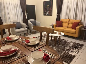 Nsibidi Suite | Living area | 55-inch Smart TV with satellite channels, Netflix, streaming services - ChallawaRiver Homes (Calabar)