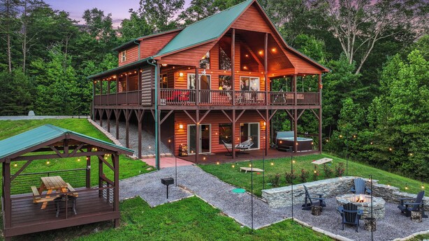 A two-story log cabin with a balcony, a fire pit, and a covered picnic area. - Murphy Cabin w/ Hot Tub, Fire Pit & Mountain Views (Murphy)
