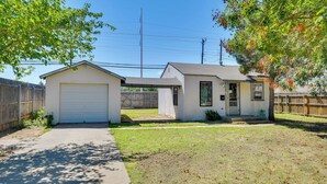 A residential property with a garage, a small house, and a covered patio area. - Convenient Lubbock Vacation Rental, 2 Mi to Ttu! (Lubbock)