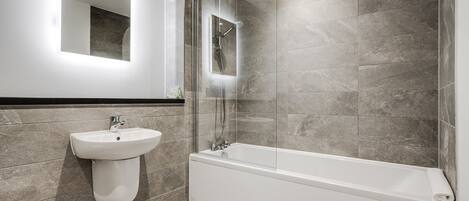 Bathtub, hair dryer, towels