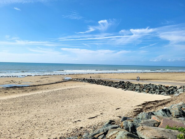 On the beach, sun-loungers