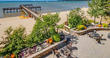 Your next vacation getaway is less than 200 steps to a private beach on the lake