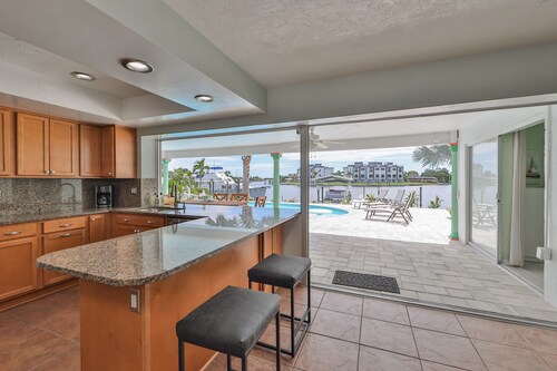 Spacious waterfront home in Apollo Beach w/ private swimming pool and boat dock.