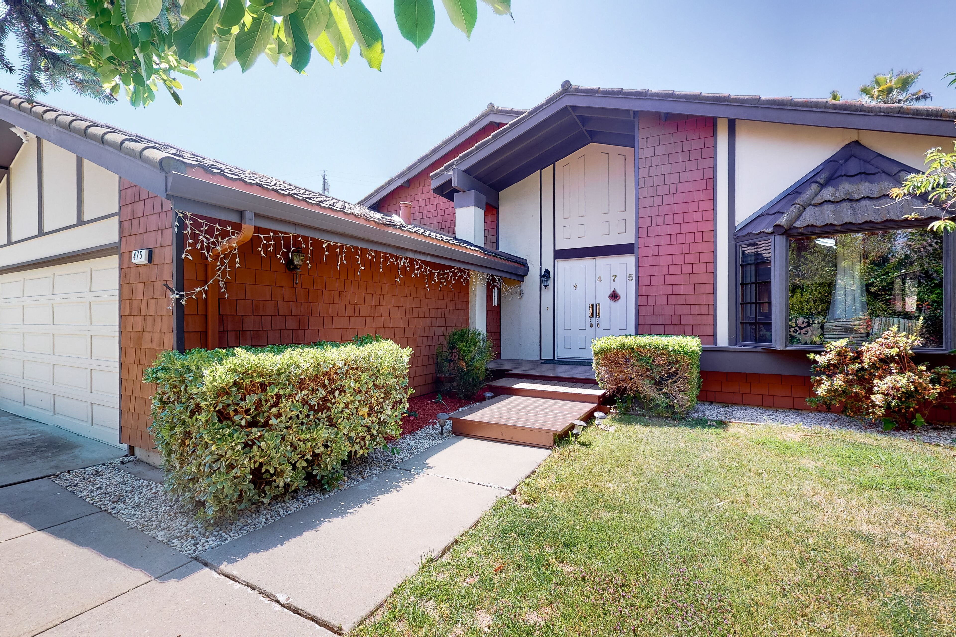Inviting home with pool, fitness area, fireplace, & W/D