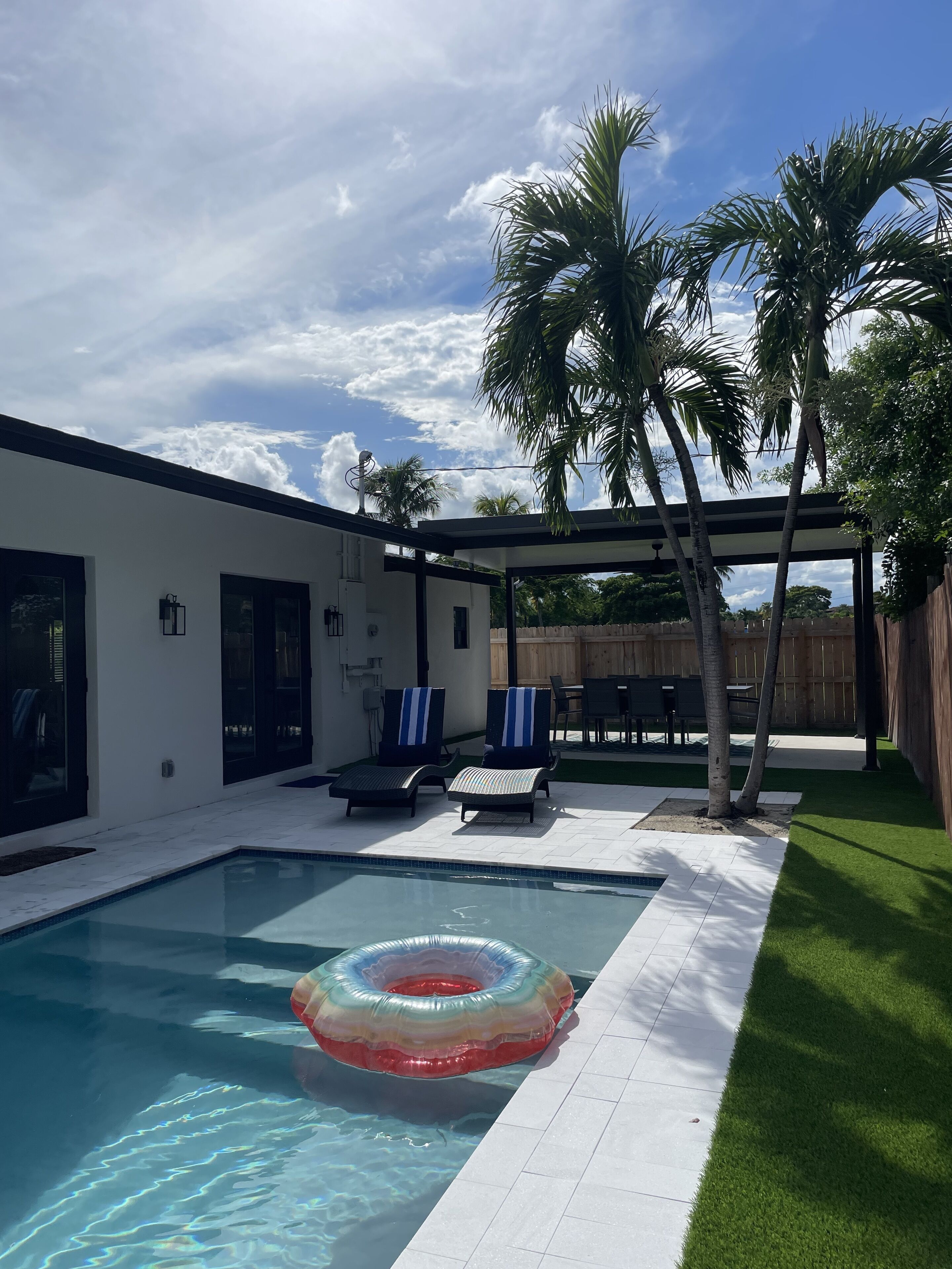 Modern, family friendly, pool home. Less than a 5 minute walk to the beach!