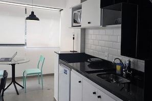 Apartment | Private kitchen - Elegance Suites Quatá (São Paulo)