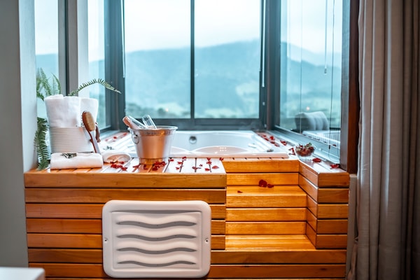 Separate bathtub and shower, slippers, towels